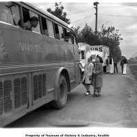 Busload of internees arriving at Camp Harmony, Puyallup, 1942
