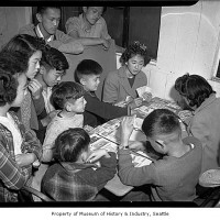 Interned children playing Monopoly at Camp Harmony, Puyallup, 1942